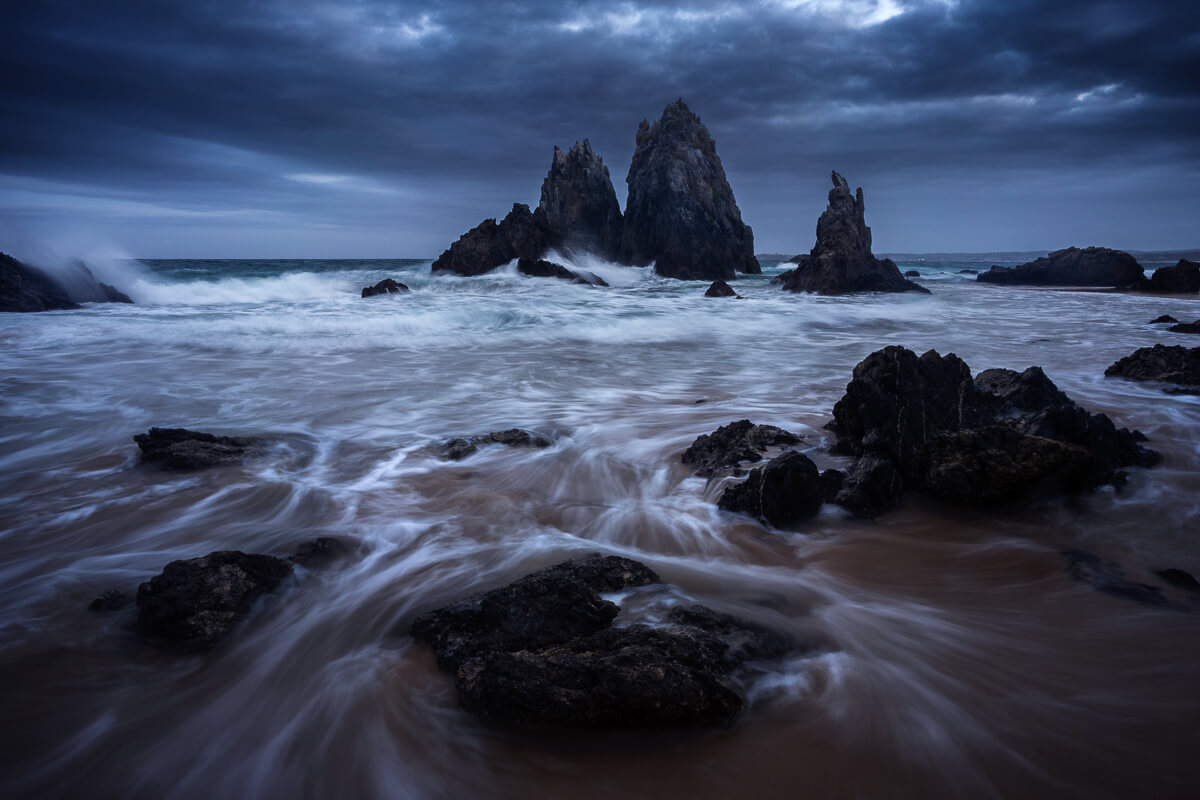 Camel Rock on the Sapphire Coast of Australia during a very angry and moody evening.