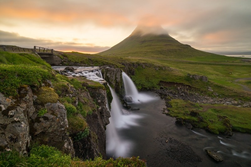 Kirkjufell mountain with waterfall during sunset
