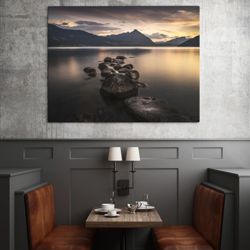 Lake of Thun during a fiery sunset. The Niesen mountain stands prominently in the distance.